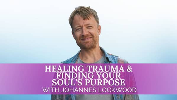 A man with short, tousled light brown hair and a beard smiles softly at the camera. He is wearing a blue plaid shirt over a gray t-shirt, standing against a light blue gradient background. Across the lower part of the image is a translucent purple banner with bold white text that reads: "Healing Trauma & Finding Your Soul’s Purpose with Johannes Lockwood.